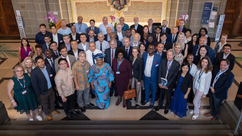 Director-General Ngozi Okonjo-Iweala and DDG Xiangchen Zhang with participants of the Chairs Programme